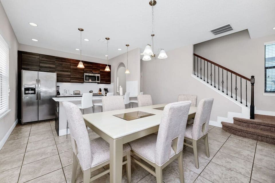 Gather around the spacious dining table, perfect for enjoying meals and making memories.