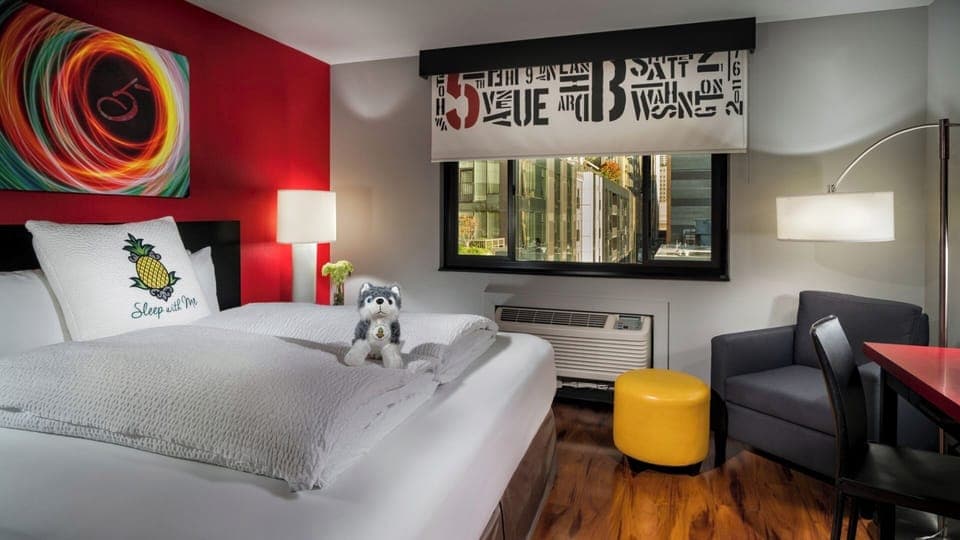 Unwind in a vibrant room with comfy bed and city views