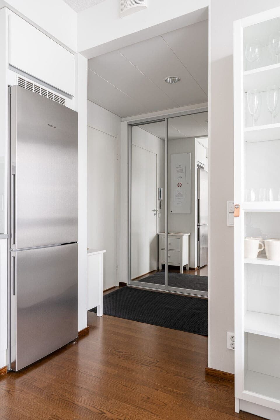 Spacious mirrored wardrobes offer plenty of room to organize your belongings and gear during your stay.