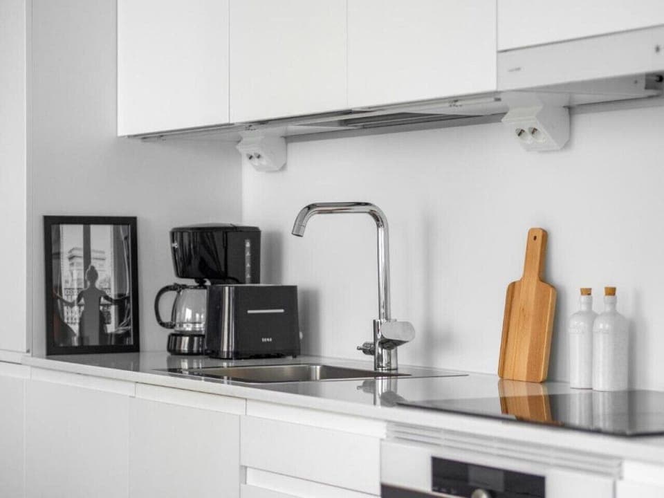 The kitchen is well equipped with cooking ware.