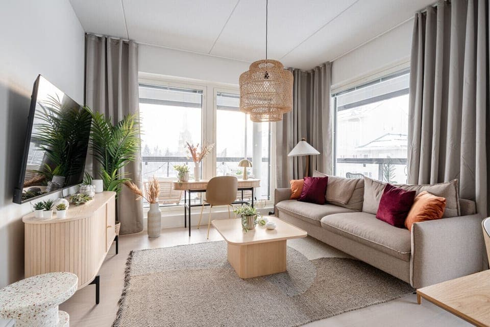 Apartment living room is spacious, modern and bright. The apartment has views to both south and west.