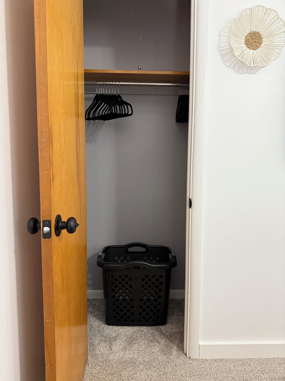 Hampers are in both closets along with hangers.