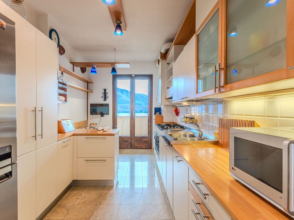 Flooring, Interior Design, Floor, Apartment, Balcony, Ceiling, Condominium, Chair, Shade, Porch