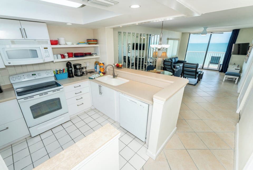 Open concept kitchen, dining and living area