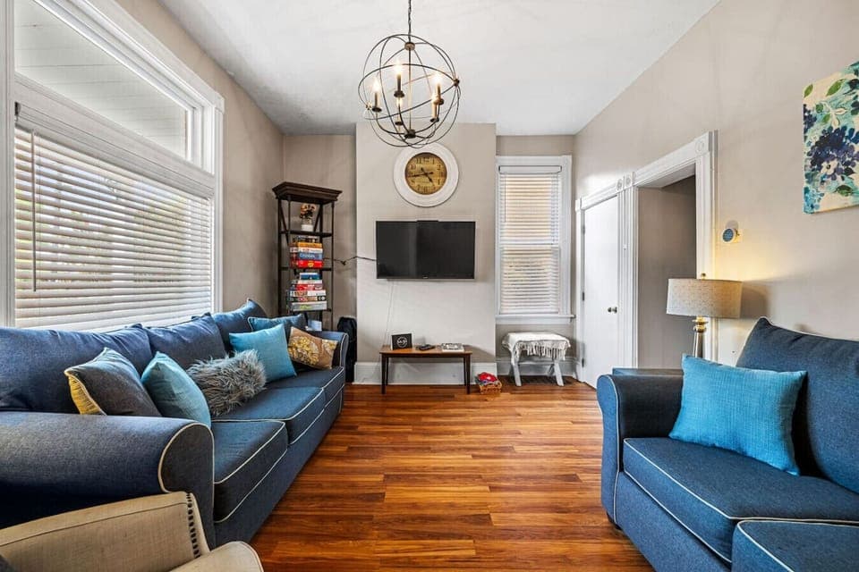 Living room with TV and comfy seating arrangement