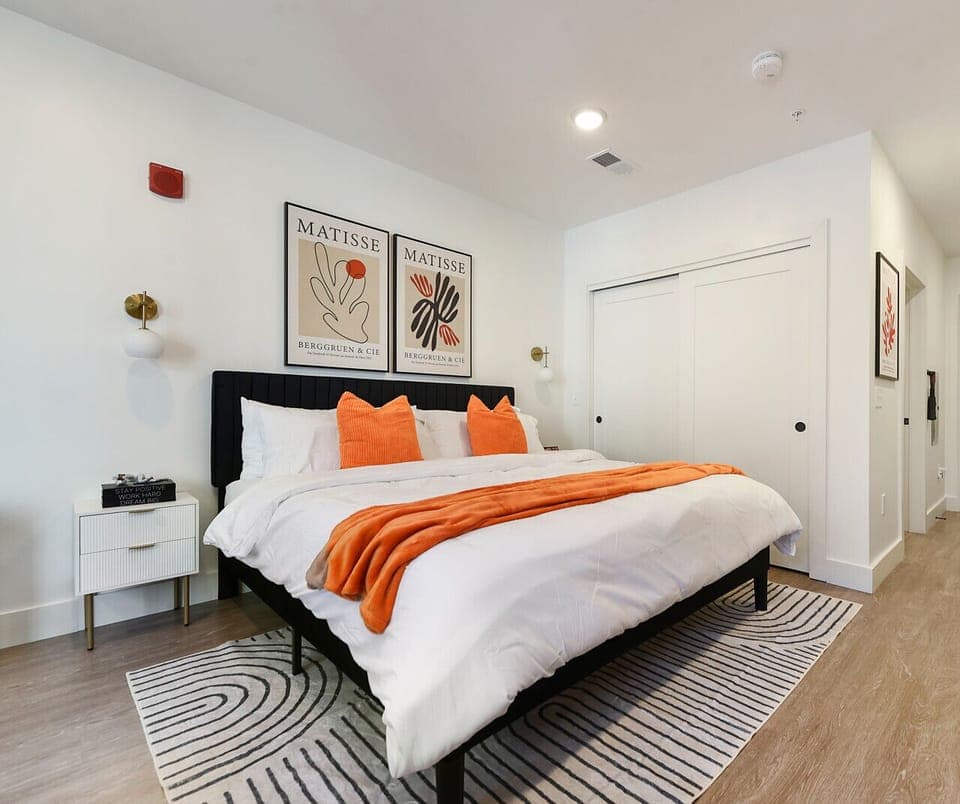 Luxury kind bed with premium pillows and crisp linens.