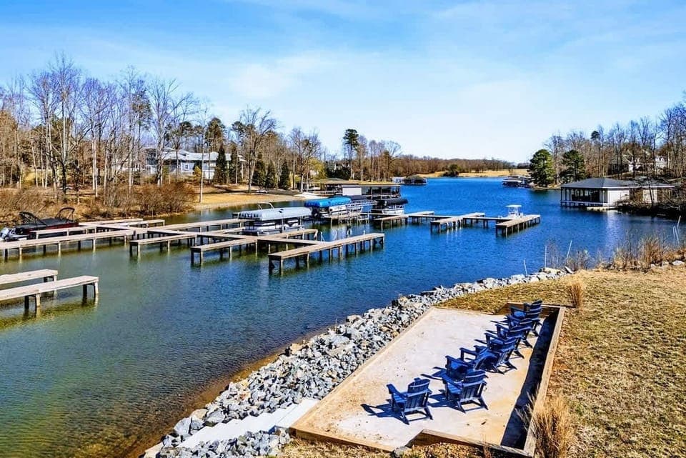 Soak in stunning lake views from this private waterfront oasis! Relax in Adirondack chairs, fish off the shore, or watch boats glide by. Launch your adventure from the dock and enjoy breathtaking sunrises, sunsets, and endless lakeside fun.
