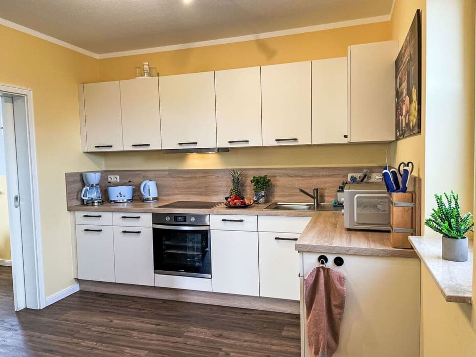 Kitchen Appliance, Kitchen, Countertop, Cabinetry, Furniture, Major Appliance, Interior Design, Flooring, Wood, Home Appliance