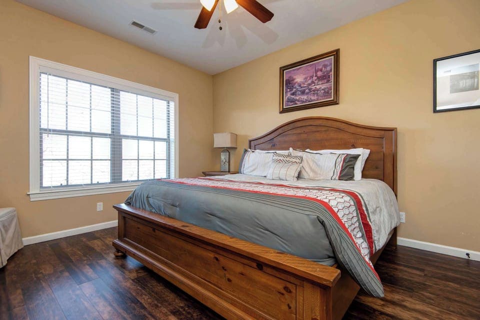  Spacious Master Bedroom with a comfortable king-size bed and direct access to a shared full bathroom—perfect for privacy and relaxation