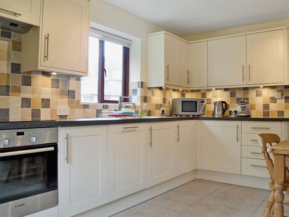 Kitchen/diner | Storrs Retreat, near Bowness on Windermere