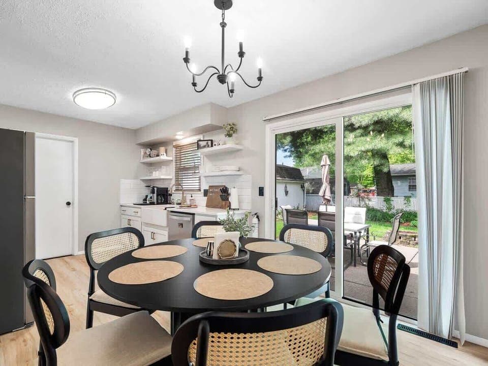 Enjoy the ease of indoor-outdoor living!  This bright dining area connects seamlessly to a fully equipped kitchen and a lush patio—ideal for coffee mornings or grilling nights with friends. ☕