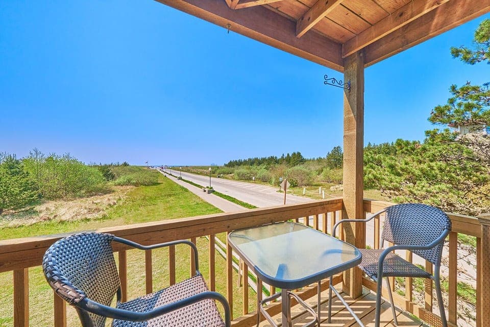 Enjoy unobstructed ocean views from the private balcony, complete with a table and two chairs—perfect for relaxing with a drink and watching the sunset.