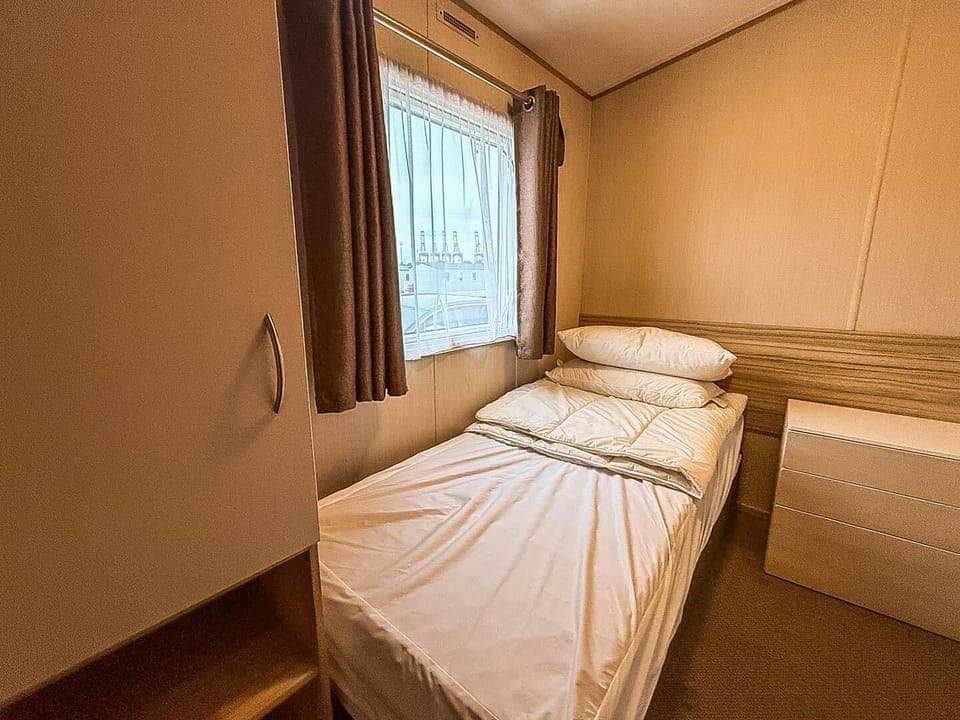 Cozy bedroom with natural light and warm wood accents