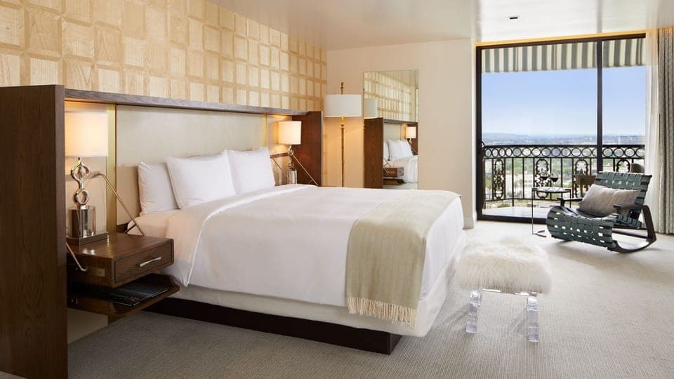 Unwind in crisp linens with sweeping city views.