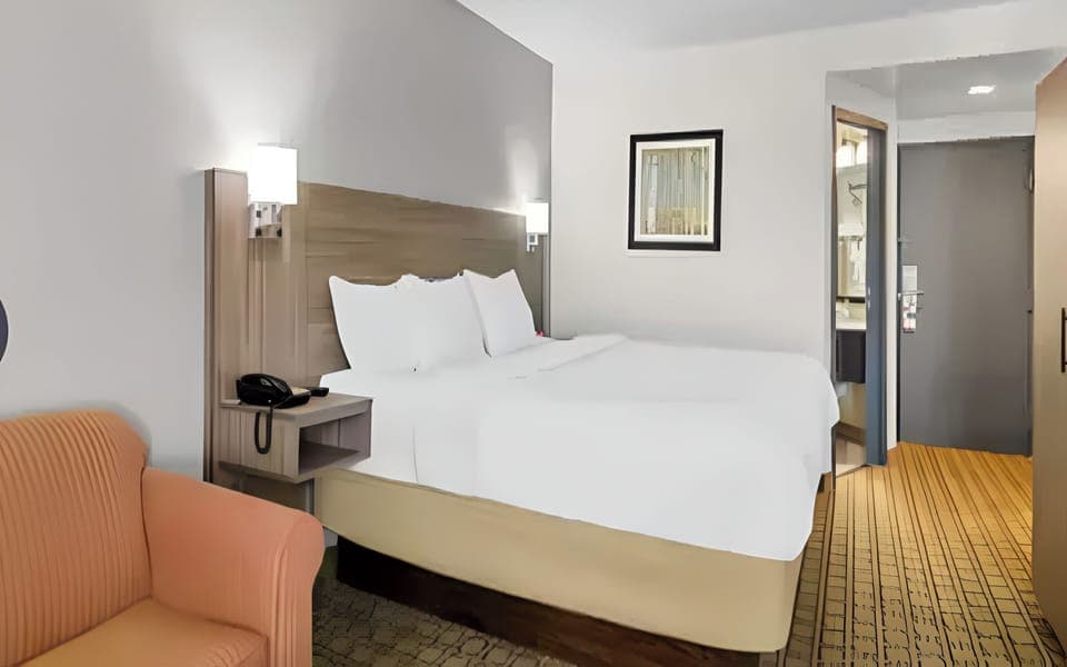 Unwind on crisp linens after a long day out.