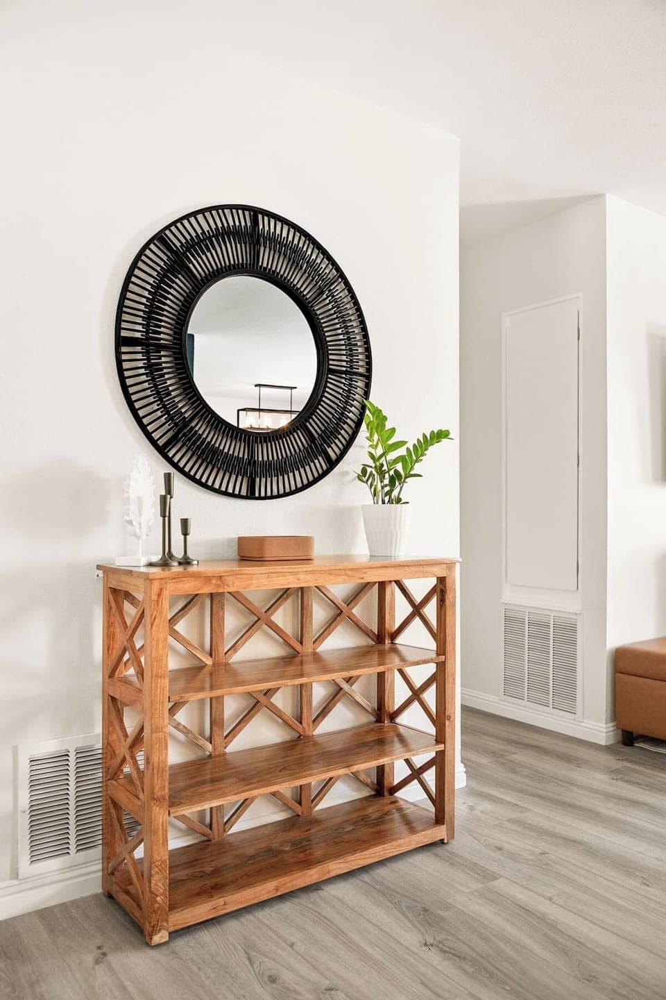 Entrance mirror and stand, perfect for storing personal items. 