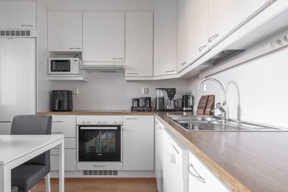 The apartment is equipped with all the modern amenities you need, including a fully stocked kitchen with a dishwasher and coffee maker