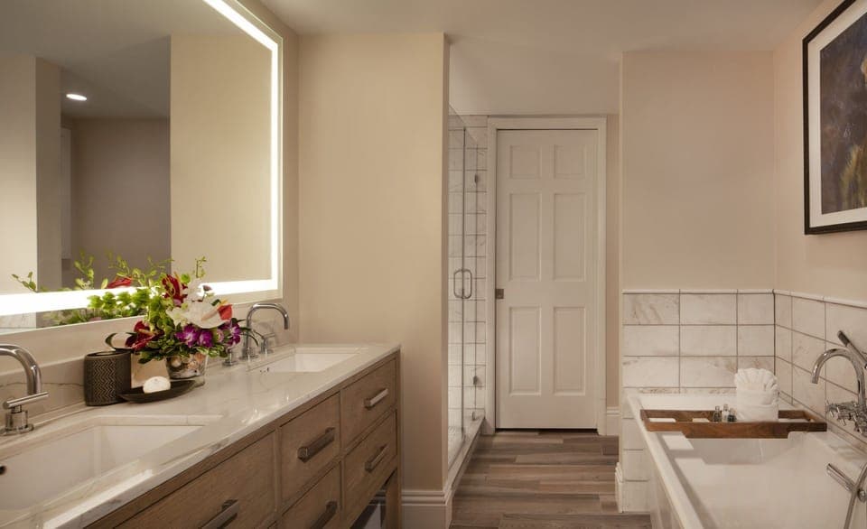 Refresh in a spa-like bath with glowing vanity mirror.