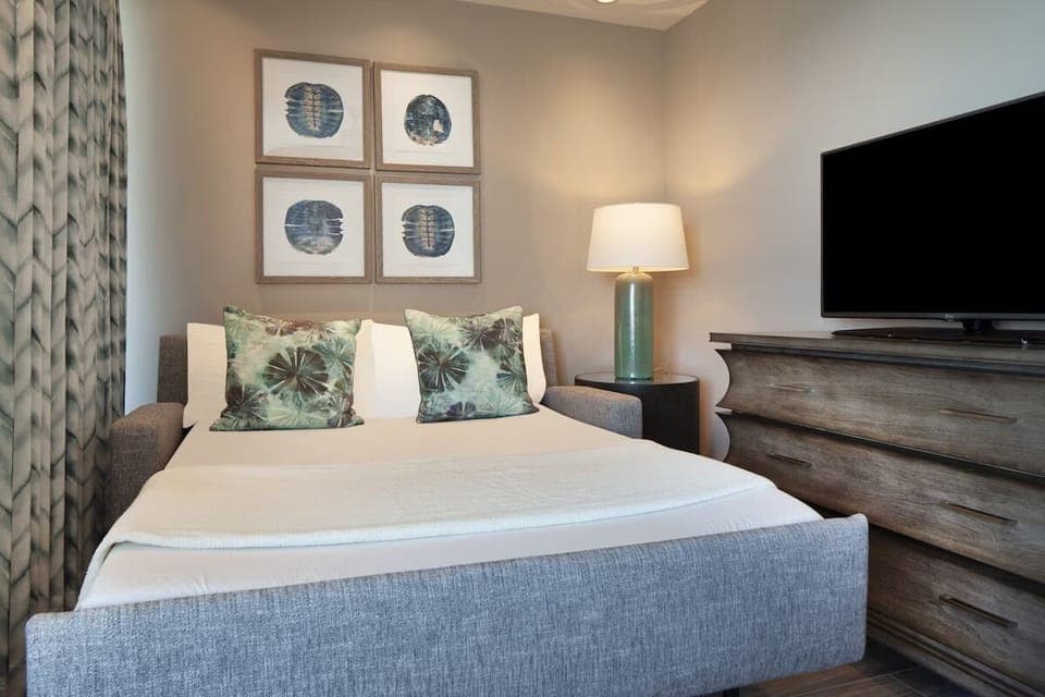 Drift off comfortably with soft lighting and calming coastal decor.