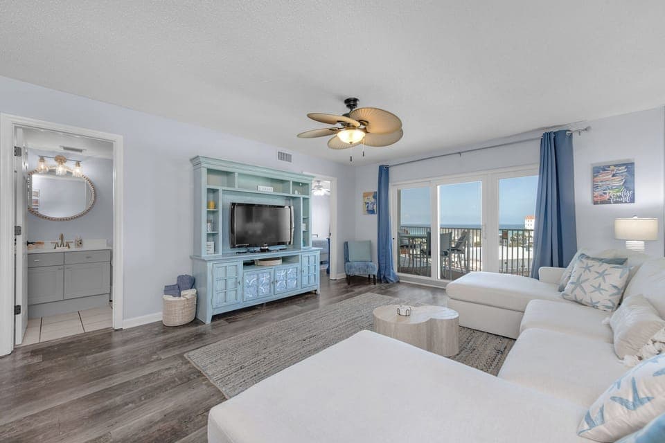 Living room with beautiful views of the beach, gulf, and sound.