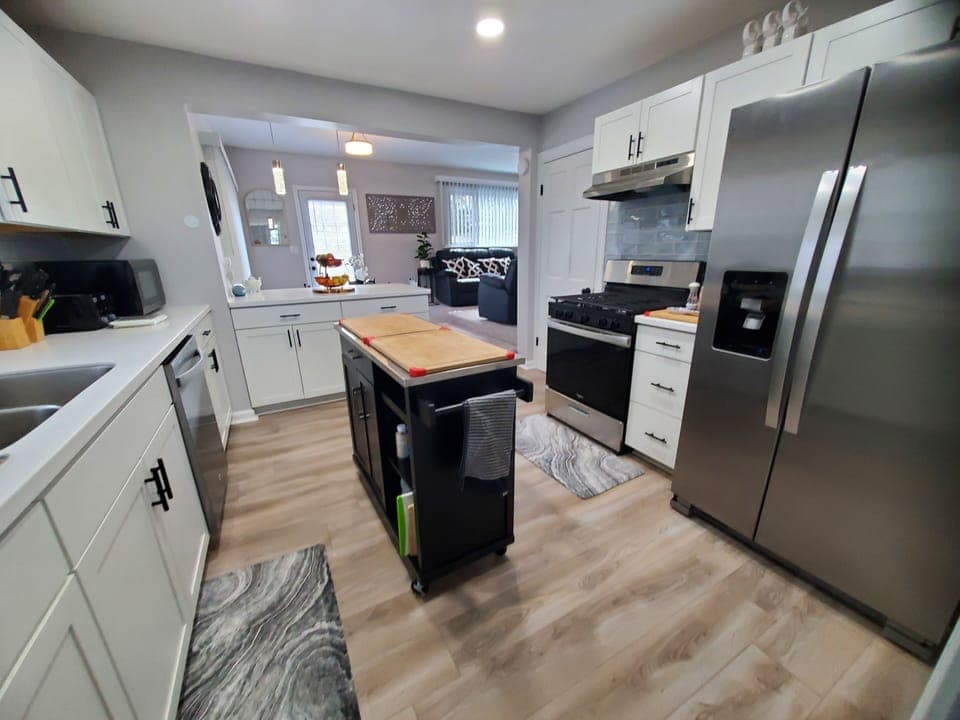 Full kitchen with island. All new appliances, basic spices and condiments.