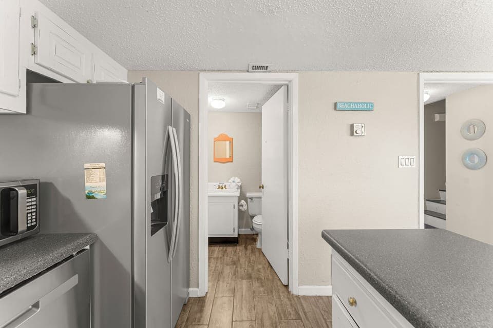Kitchen/Half Bath/Laundry - On the first floor of the condo you have a half bath and laundry room conveniently located next to the kitchen.