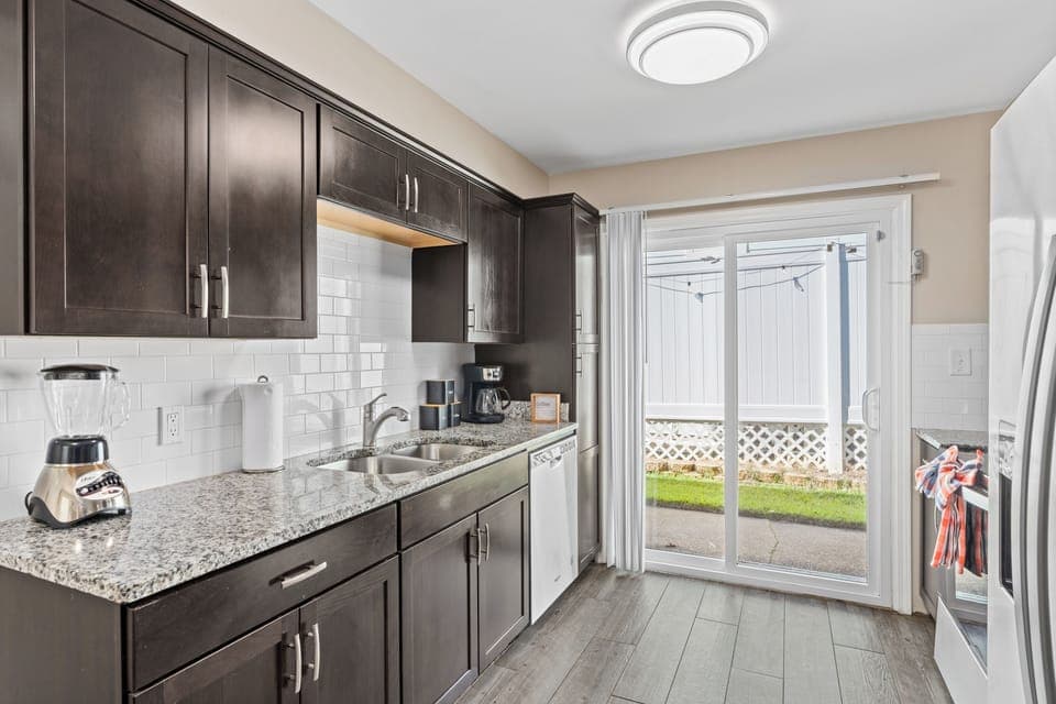 Sleek kitchen with stainless steel appliances and elegant finishes.