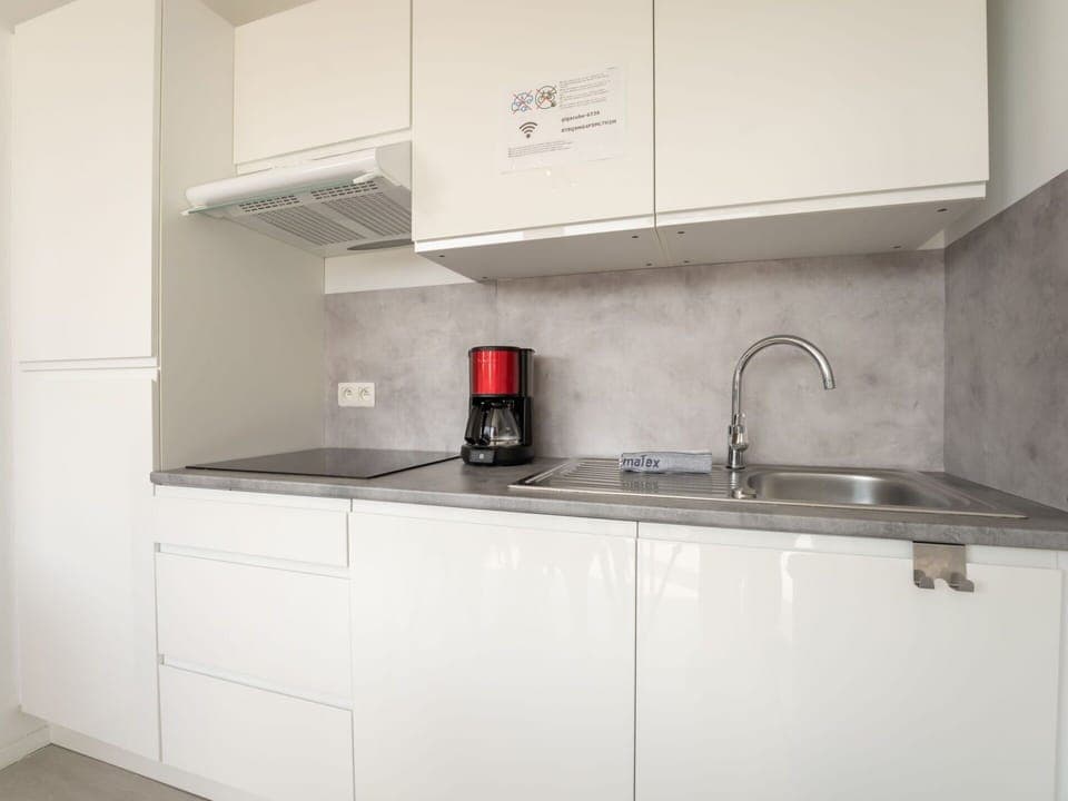 Countertop, Kitchen, Cabinetry, Kitchen Appliance, Interior Design, Flooring, Major Appliance, Sink, Kitchen Sink, Furniture