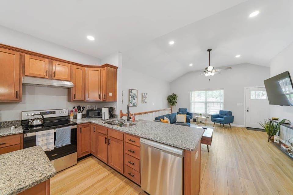 Kitchen: A modern kitchen with granite countertops and stainless steel appliances.
