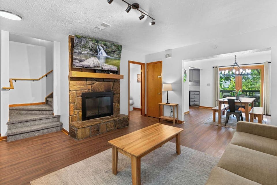 Relax by the stone fireplace and enjoy scenic views from the dining area!