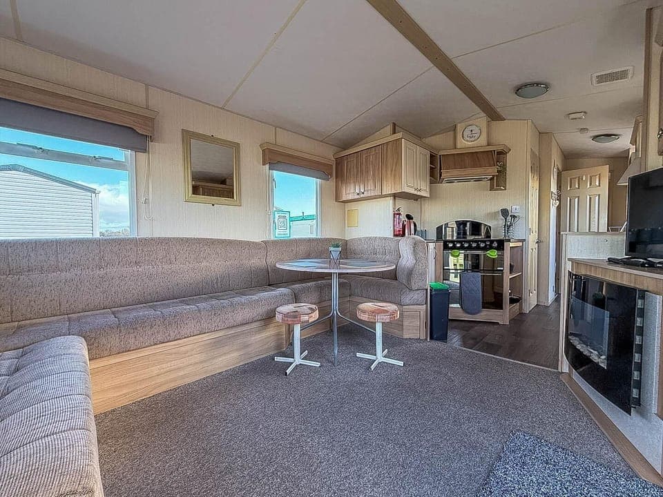 Cozy living and dining area with panoramic windows