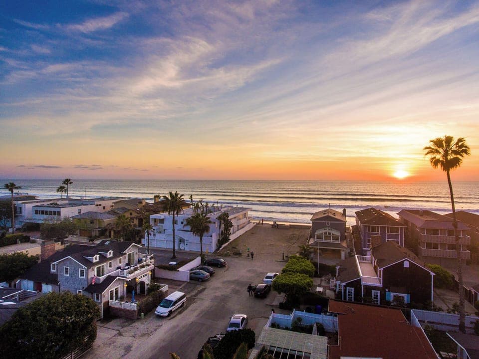 Your dream vacation starts here, steps from the sand in Del Mar, experience unbeatable coastal charm, vibrant sunsets, fall asleep to the sound of waves, walk directly to the beach, Southern California's magic is just missing you.