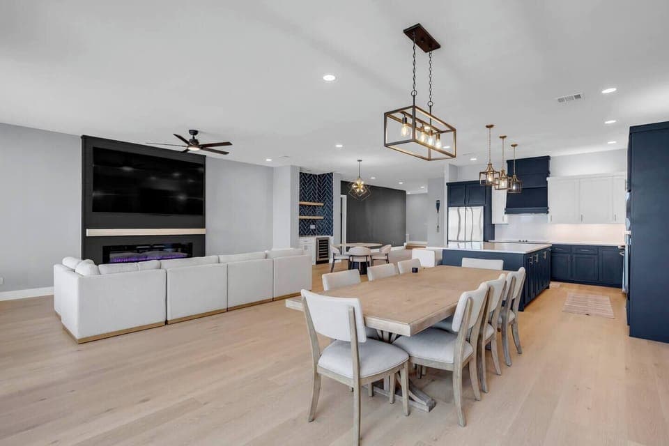 Living Room with 100in TV and dining table for 8