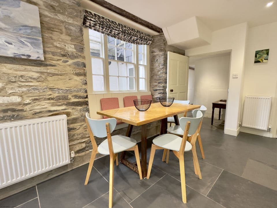 Dining table into hallway of 36 High Street Holiday Cottage, Padstow, North Cornwall