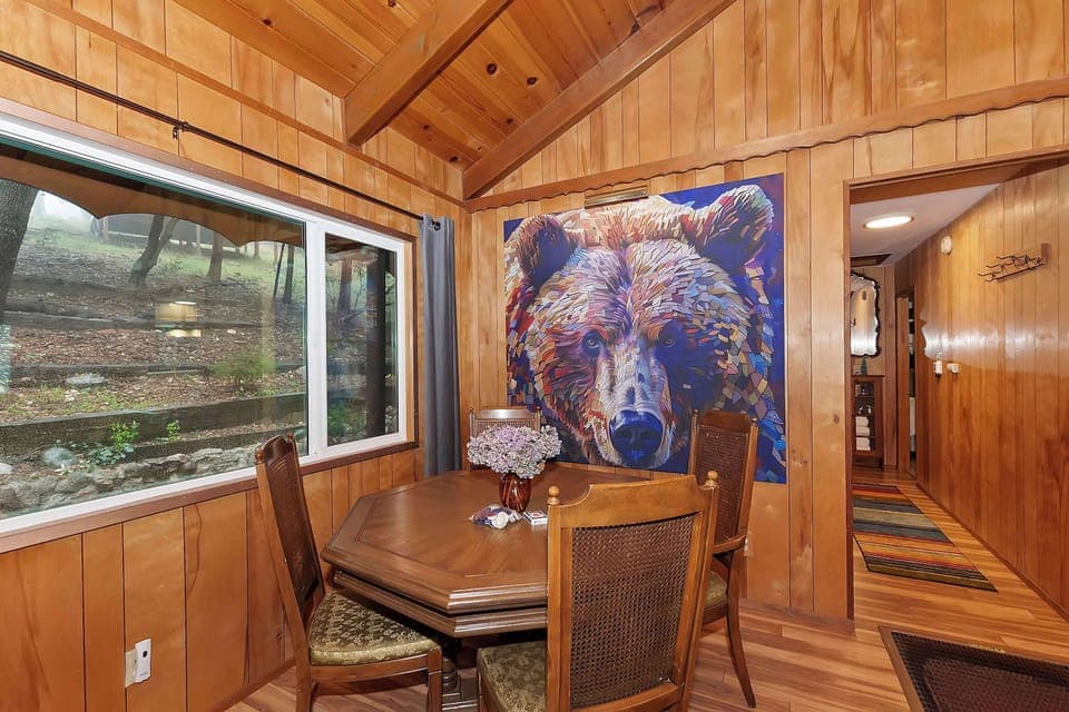 Dining table with seating for 4, doubles up as a poker or game table.