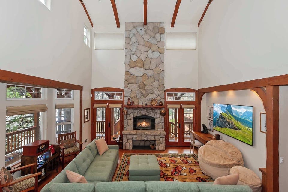 Welcome to your vacation! Relax and unwind in the great living room with vaulted ceiling and a floor to ceiling stone fireplace.