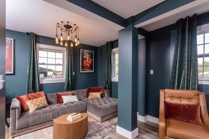 Inviting lounge area w/ cozy seating, rich colors & elegant lighting touches