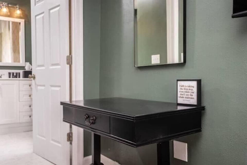 Modern vanity space w/ sleek black sink & clean contemporary finishes