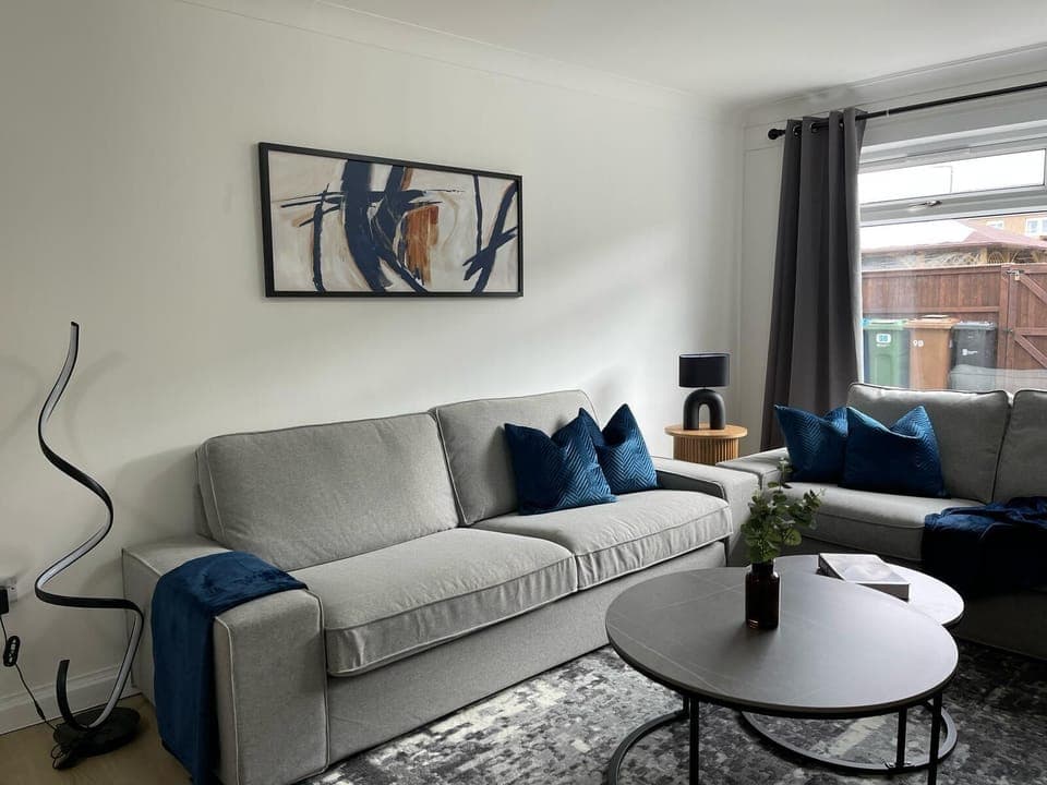 Step into style and comfort in this modern lounge—featuring plush seating, elegant decor, and plenty of natural light for a relaxing stay.