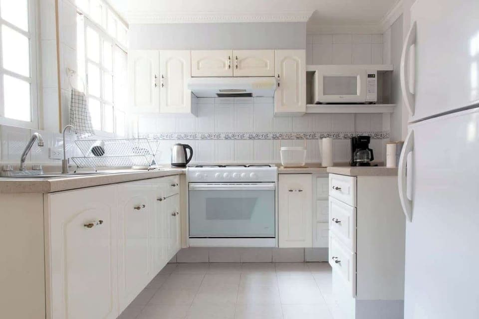 A fully-equipped kitchen with all the appliances, cookware and utensils you’d need to prepare and enjoy meals at home