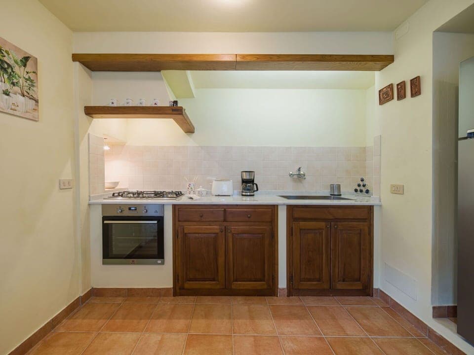 Countertop, Kitchen, Kitchen Appliance, Flooring, Furniture, Major Appliance, Interior Design, Cabinetry, Wood, Ceiling