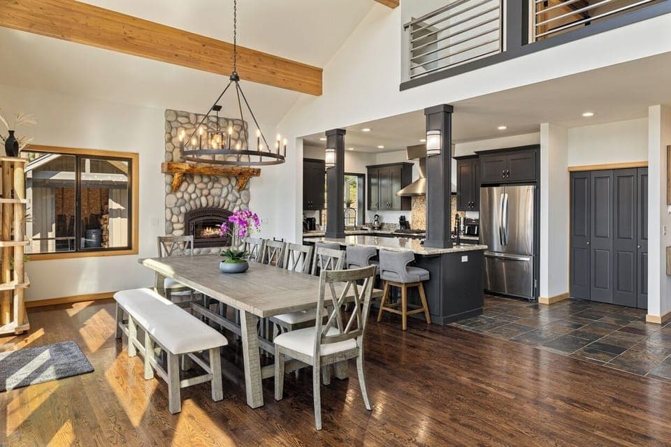 Gourmet kitchen with 9' table for 10, bar seating, and wood-burning fireplace