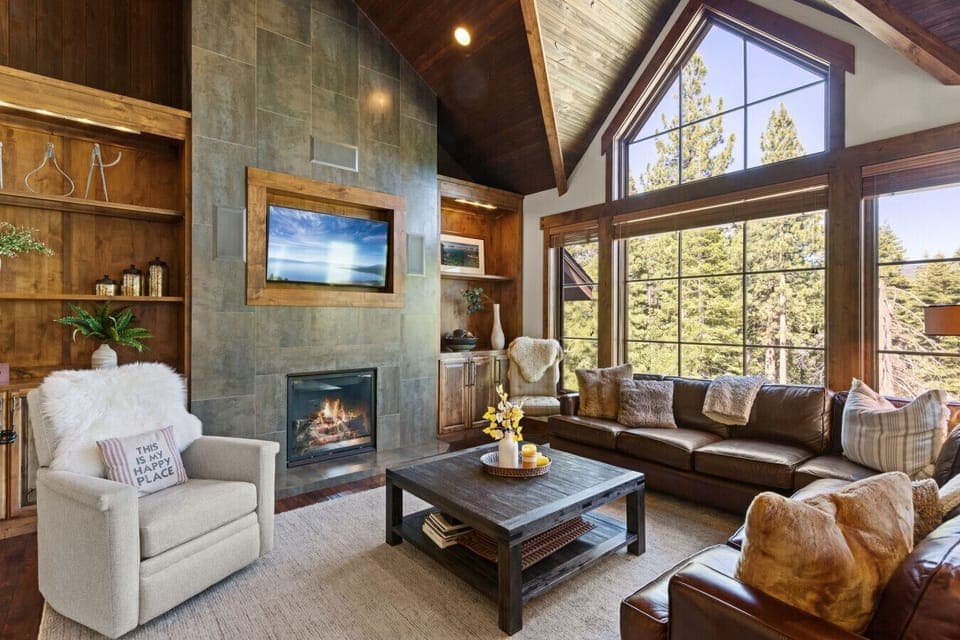 Living Room: Stunning views and inviting warmth await in this stylish, wood-accented retreat!