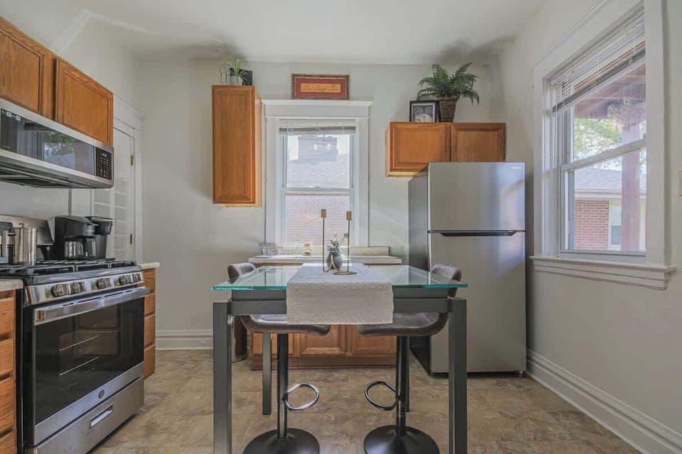 Kitchen view w/ dining table, making meals and conversation effortless.