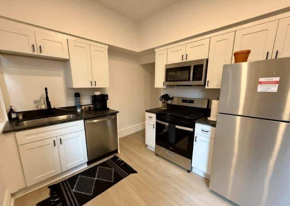 Step into our Columbus kitchen where sleek design meets functionality, featuring stylish cabinetry and high-end appliances! Cook with ease and enjoy a dining experience that feels like home 