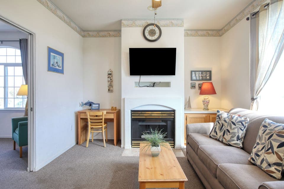 Welcome to Seaside Setting, Unit 109! Your breezy upstairs one-bedroom beach retreat features a comfy king bed and a sleeper sofa for extra guests. Kick back in the full kitchen, perfect for whipping up seaside snacks after a day on the sand.