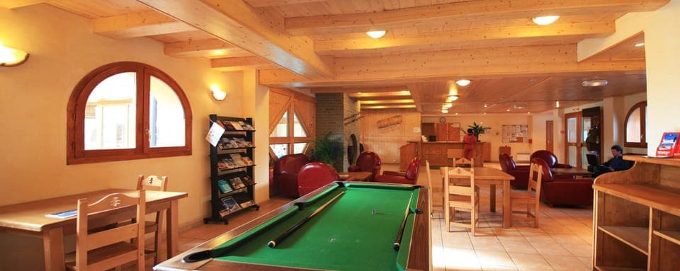 Enjoy the pool table, available for a charge.