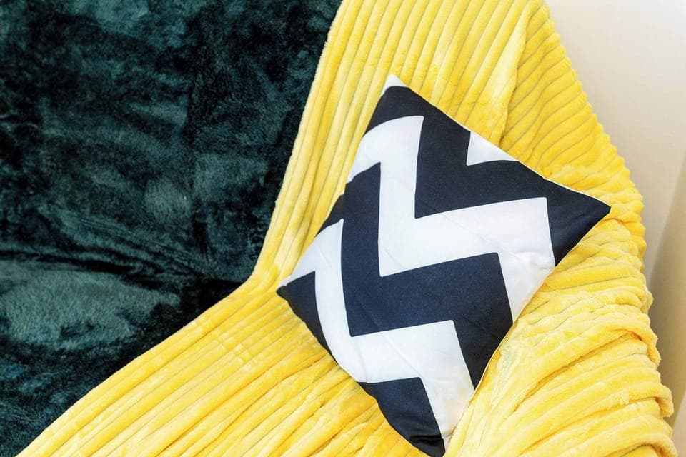 Living Area | Sofa with Extra Blankets and Pillows for Added Comfort