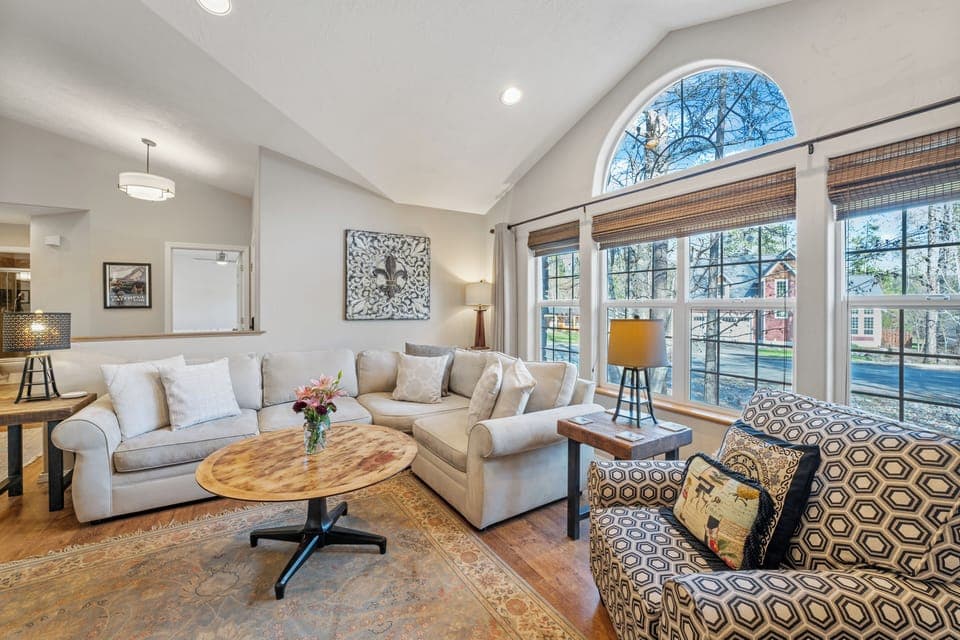 Living area with sectional sofa and large windows