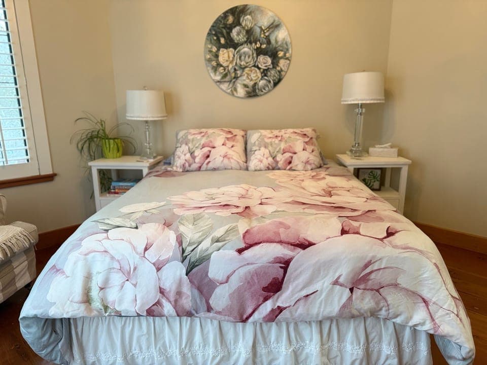 This bedroom exudes warmth and elegance with its soft neutral colors and decor. 